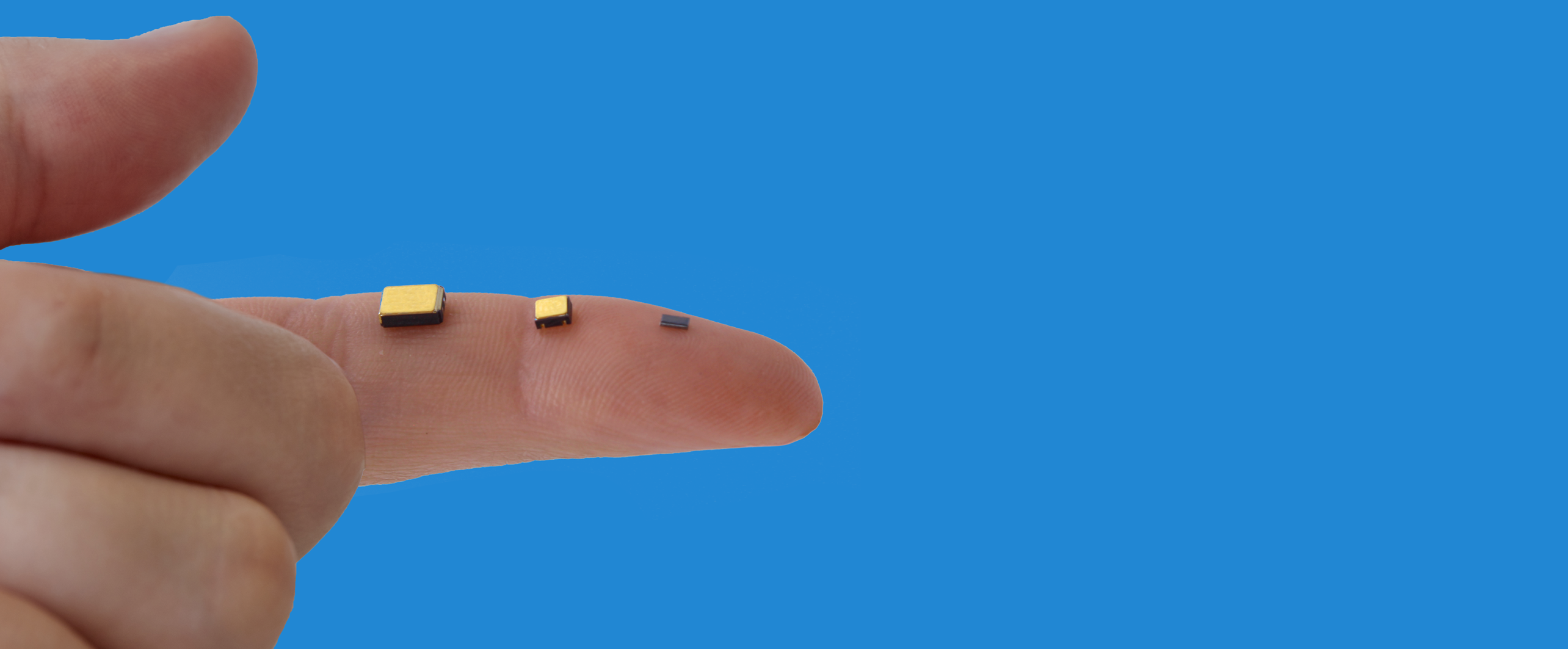 Finger with various High-Resolution IVA Testing components against a blue background for ORS website
